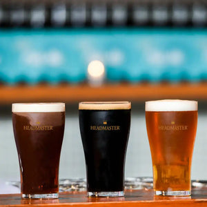 Three glasses of beer in different shades.